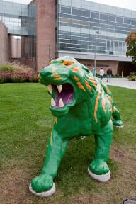 Sculpture of a green and yellow tiger.
